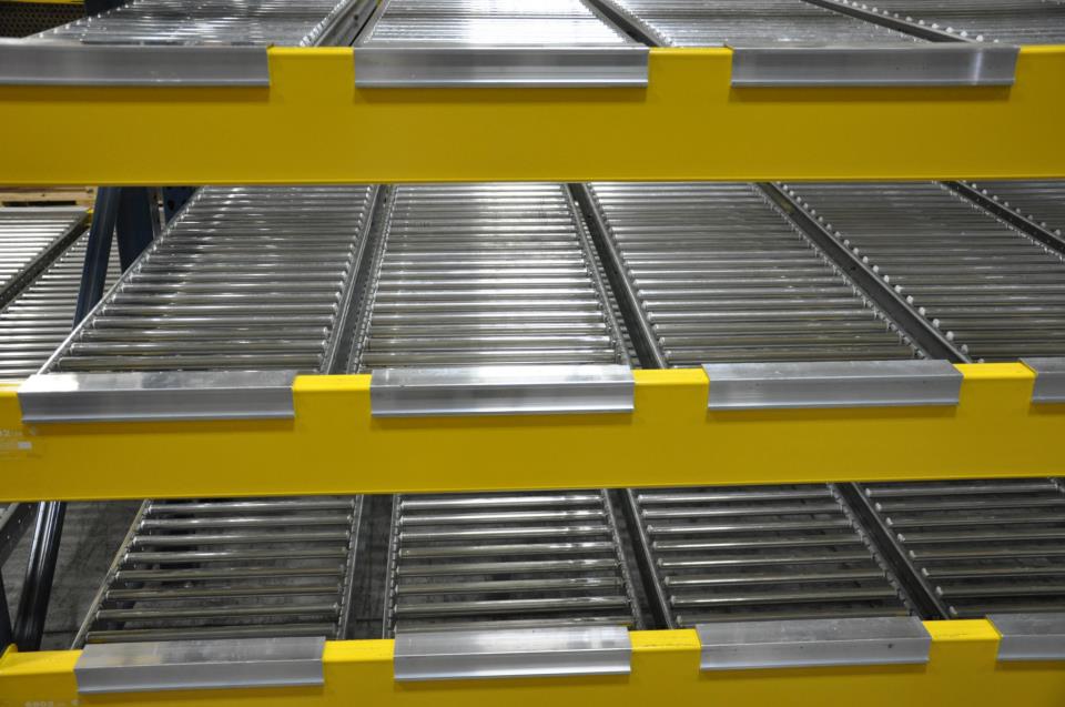 Carton flow shelving in use on a warehouse pick line